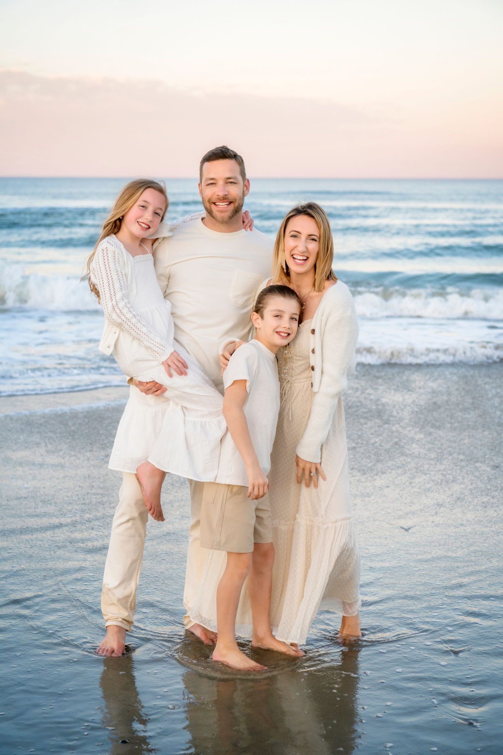 Gary Andress with his wife and two children on the beach